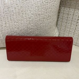 Gucci embossed clutch